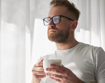 Man with morning coffee at home